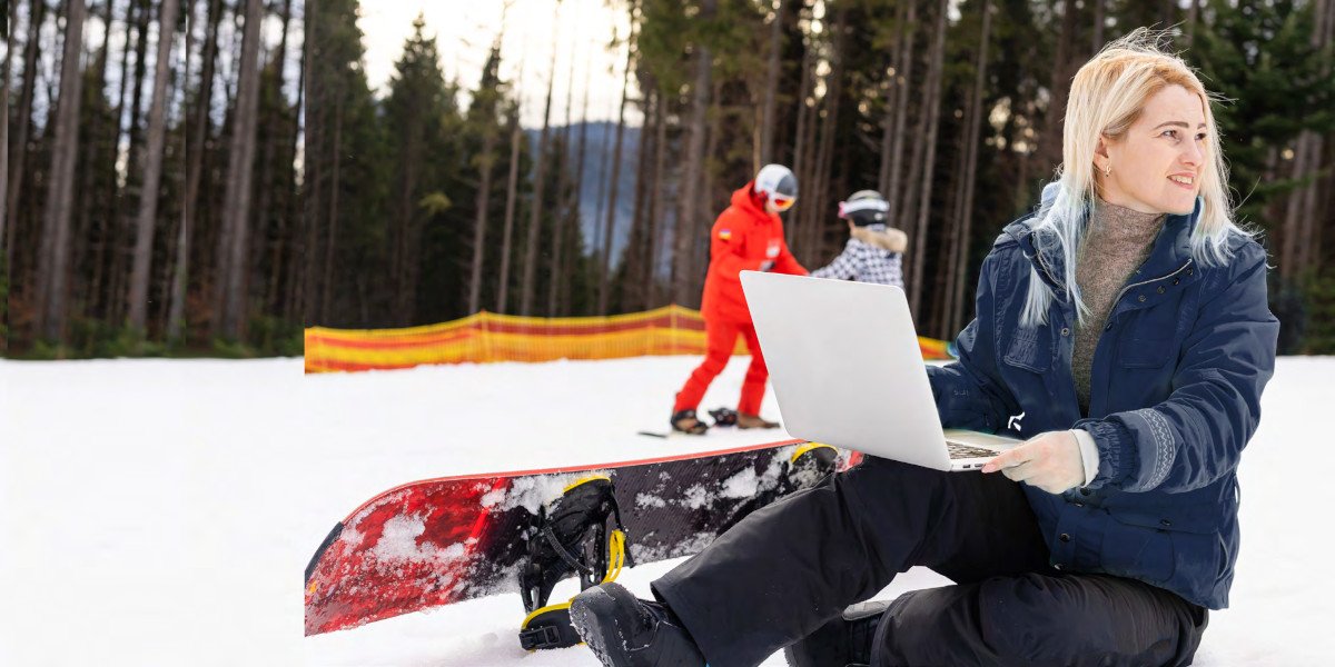 woman with laptop and snowboard