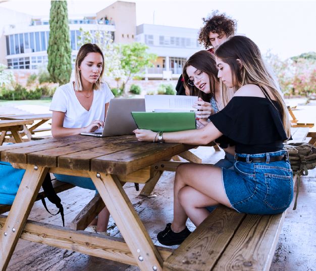 women at a picnic table